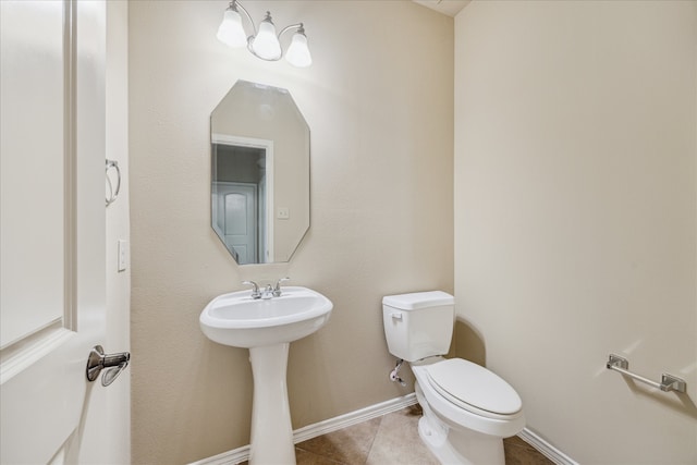 bathroom featuring tile patterned floors, sink, and toilet