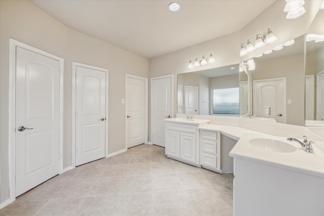 bathroom with tile patterned flooring and vanity