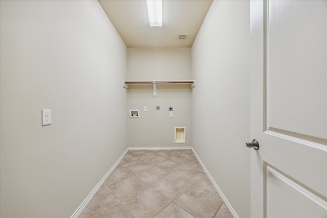 laundry room featuring electric dryer hookup, gas dryer hookup, light tile patterned floors, and washer hookup