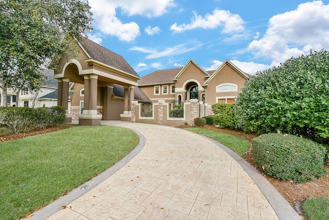 view of front of home with a front lawn