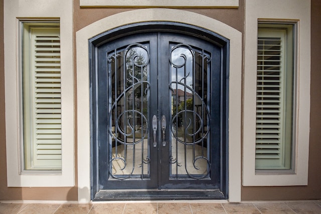 property entrance featuring french doors