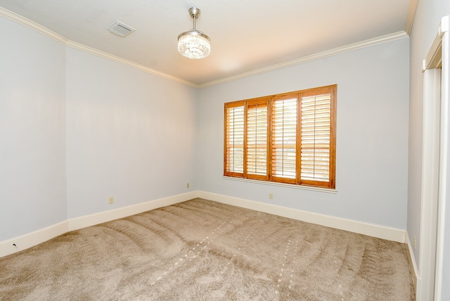 spare room featuring carpet floors and ornamental molding