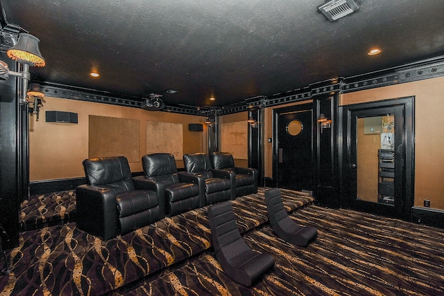 home theater room with a textured ceiling