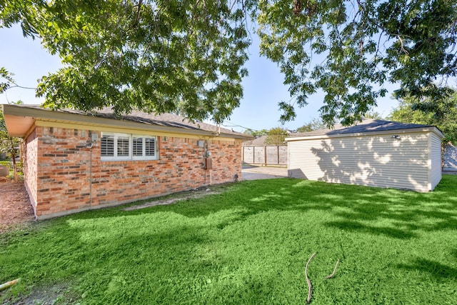 rear view of property with a yard