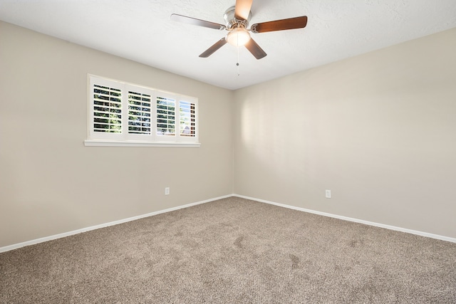 empty room featuring carpet flooring, a textured ceiling, and ceiling fan