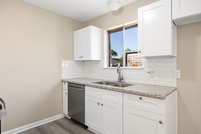 kitchen featuring white cabinetry, dishwasher, sink, dark wood-type flooring, and light stone counters