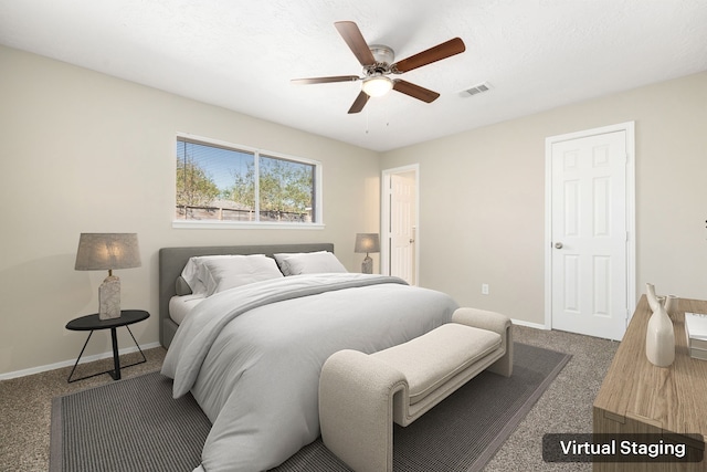 bedroom featuring ceiling fan and dark carpet