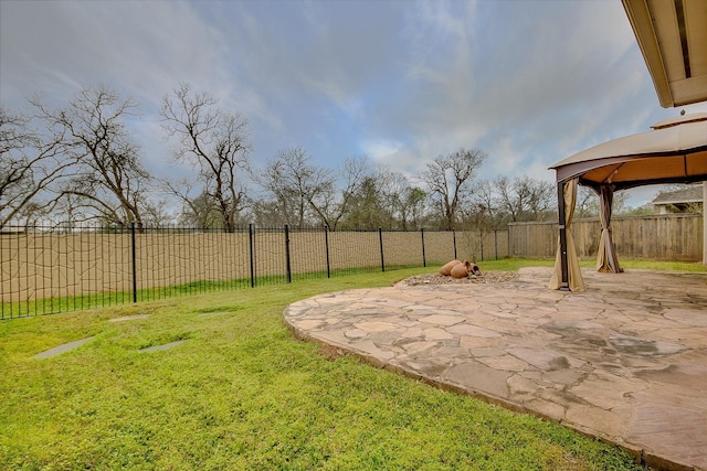 view of yard featuring a gazebo and a patio area