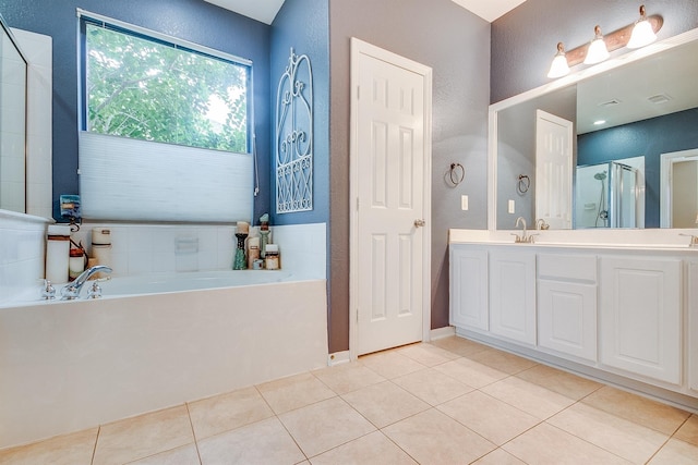 bathroom with tile patterned flooring, vanity, and independent shower and bath