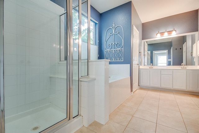 bathroom with tile patterned flooring, vanity, and independent shower and bath