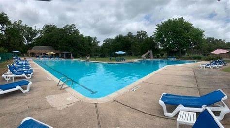 view of pool featuring a patio and a water slide