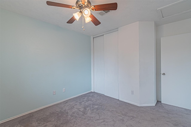 unfurnished bedroom featuring a closet, ceiling fan, and carpet floors