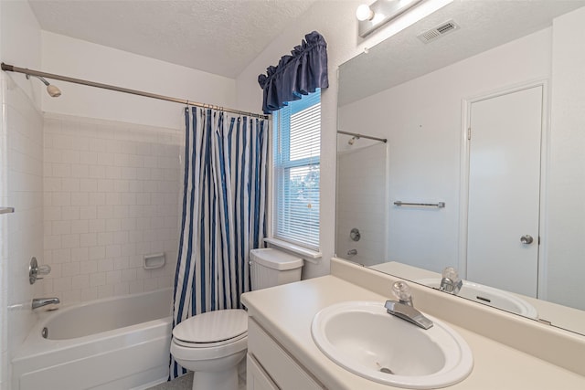 full bathroom featuring toilet, a textured ceiling, vanity, and shower / tub combo