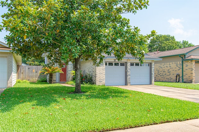 view of front of house with a front lawn and a garage