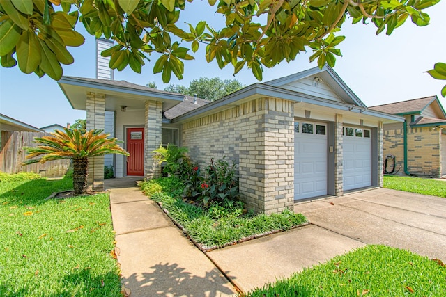 ranch-style house with a garage and a front yard