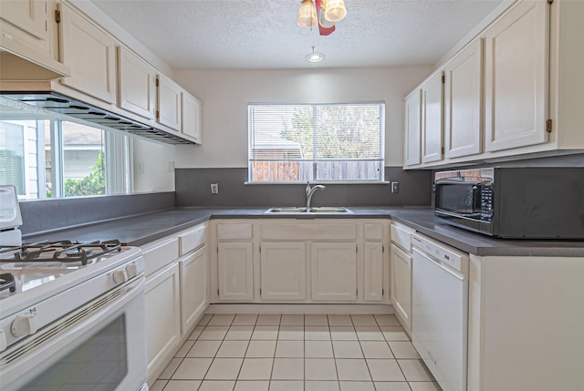 kitchen with white cabinetry, white appliances, sink, and light tile patterned floors