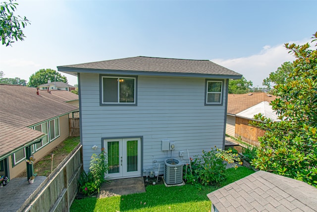 back of property featuring a patio, french doors, and central AC