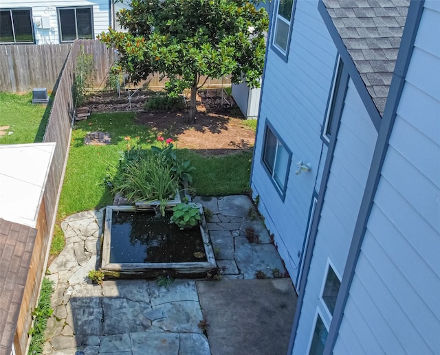 view of storm shelter with a yard