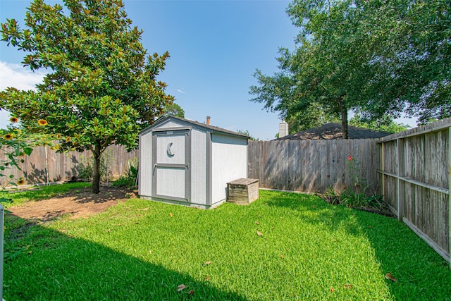 view of outbuilding featuring a yard