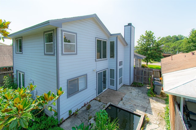 back of house with a patio