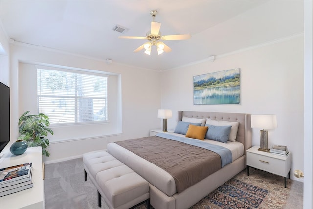 bedroom featuring visible vents, carpet floors, baseboards, and crown molding