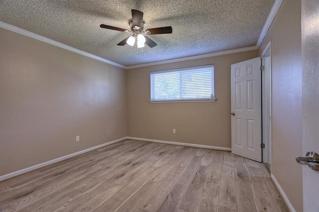 spare room with a textured ceiling, light hardwood / wood-style flooring, ceiling fan, and crown molding