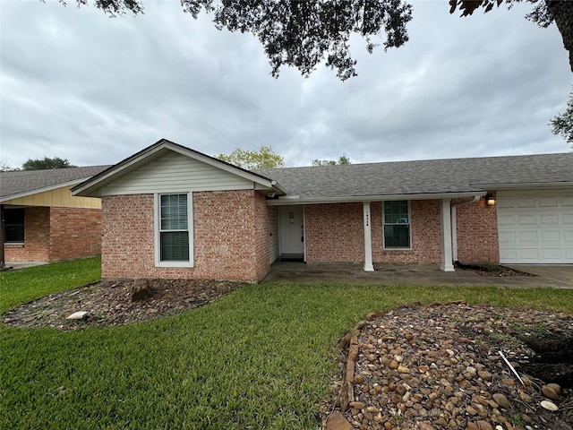 single story home with a front lawn and a garage