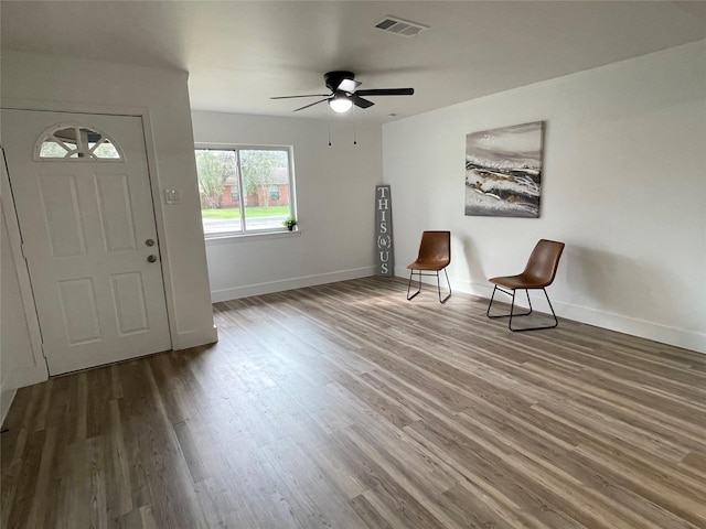 entryway with hardwood / wood-style flooring and ceiling fan