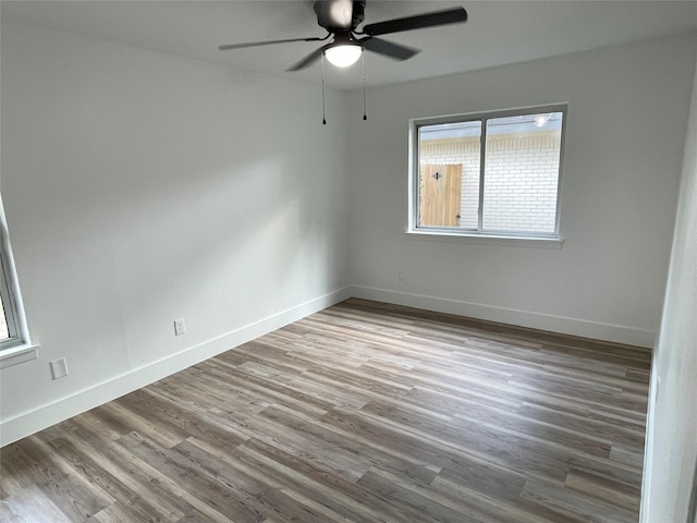 empty room with light hardwood / wood-style flooring and ceiling fan