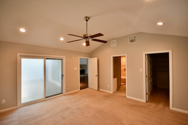 unfurnished bedroom with access to exterior, ceiling fan, ensuite bathroom, light colored carpet, and lofted ceiling