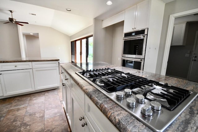 kitchen with ceiling fan, white cabinetry, lofted ceiling, and appliances with stainless steel finishes