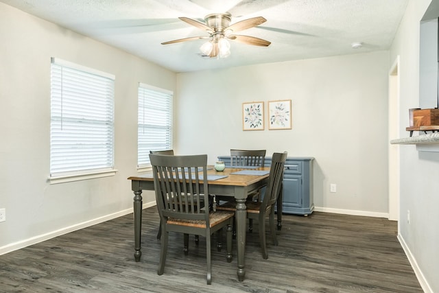 dining space featuring ceiling fan and dark wood-type flooring