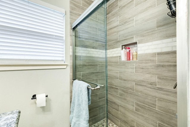 bathroom featuring an enclosed shower