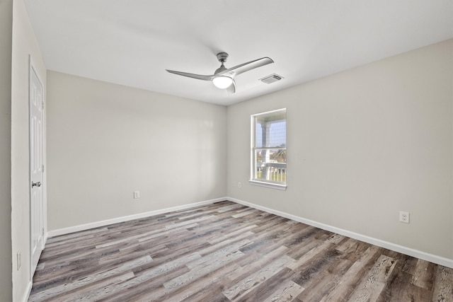 empty room with wood-type flooring and ceiling fan