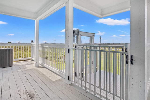 wooden deck featuring central air condition unit