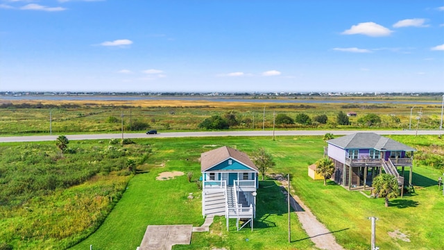 birds eye view of property featuring a rural view