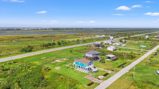 birds eye view of property with a rural view and a water view