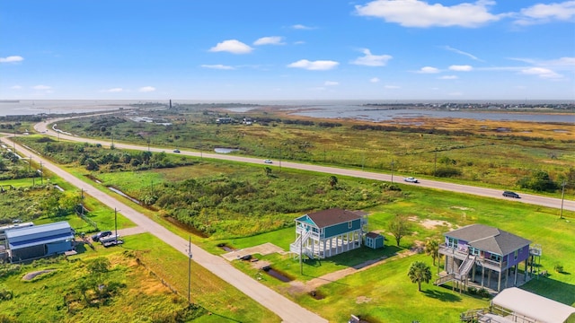 drone / aerial view with a rural view and a water view