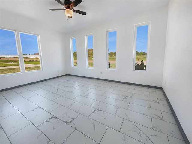 unfurnished room featuring ceiling fan