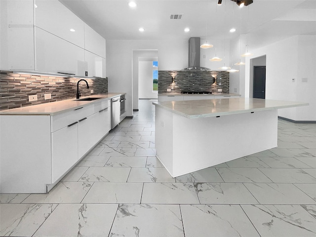 145 Birdie Dr, Hempstead, TX 77445 - kitchen featuring a sink, island exhaust hood, light marble finish flooring, modern cabinets, and recessed lighting