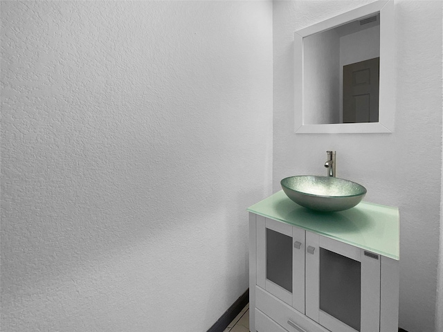 145 Birdie Dr, Hempstead, TX 77445 - bathroom with vanity and a textured wall