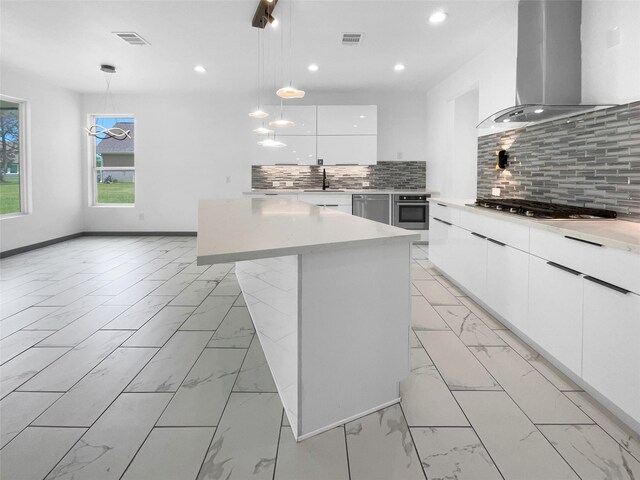 145 Birdie Dr, Hempstead, TX 77445 - kitchen featuring island range hood, appliances with stainless steel finishes, modern cabinets, light marble finish floors, and recessed lighting