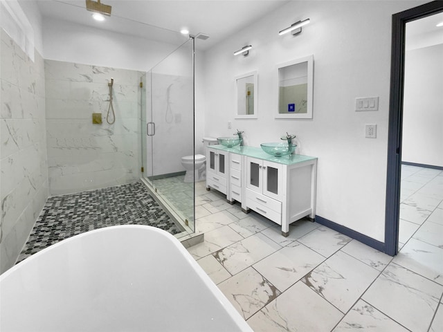 145 Birdie Dr, Hempstead, TX 77445 - full bathroom with marble finish floors, a marble finish shower, a freestanding bath, double vanity, and toilet