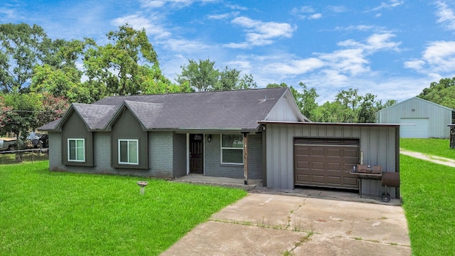 ranch-style home with a garage and a front lawn