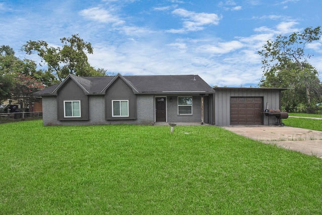 ranch-style home with a front lawn and a garage