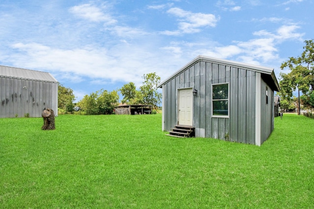 view of outdoor structure featuring a yard