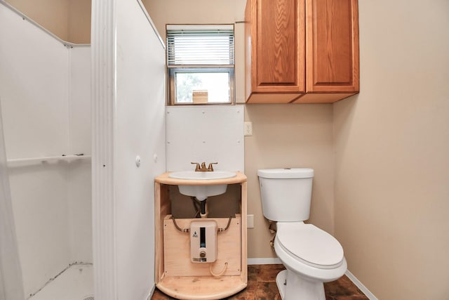 bathroom featuring sink and toilet