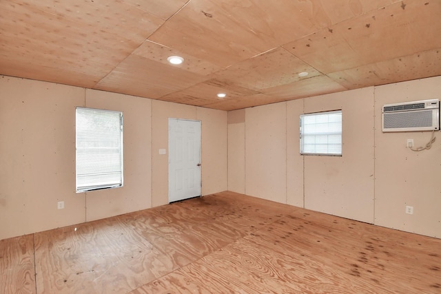 basement featuring a wall mounted AC