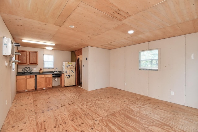 kitchen featuring sink, a wealth of natural light, and white refrigerator