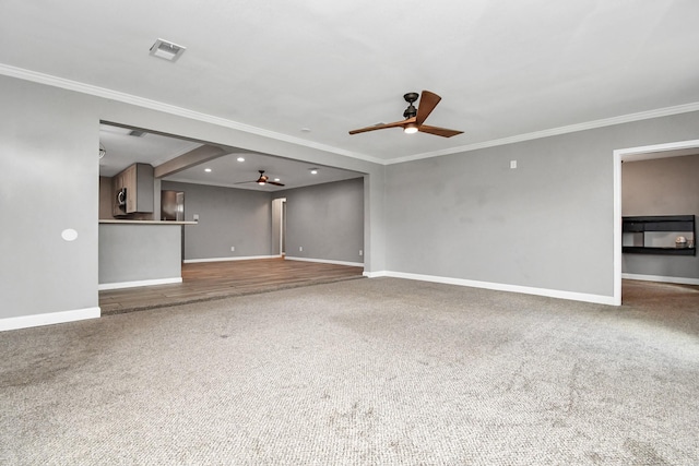 unfurnished living room with carpet and ornamental molding